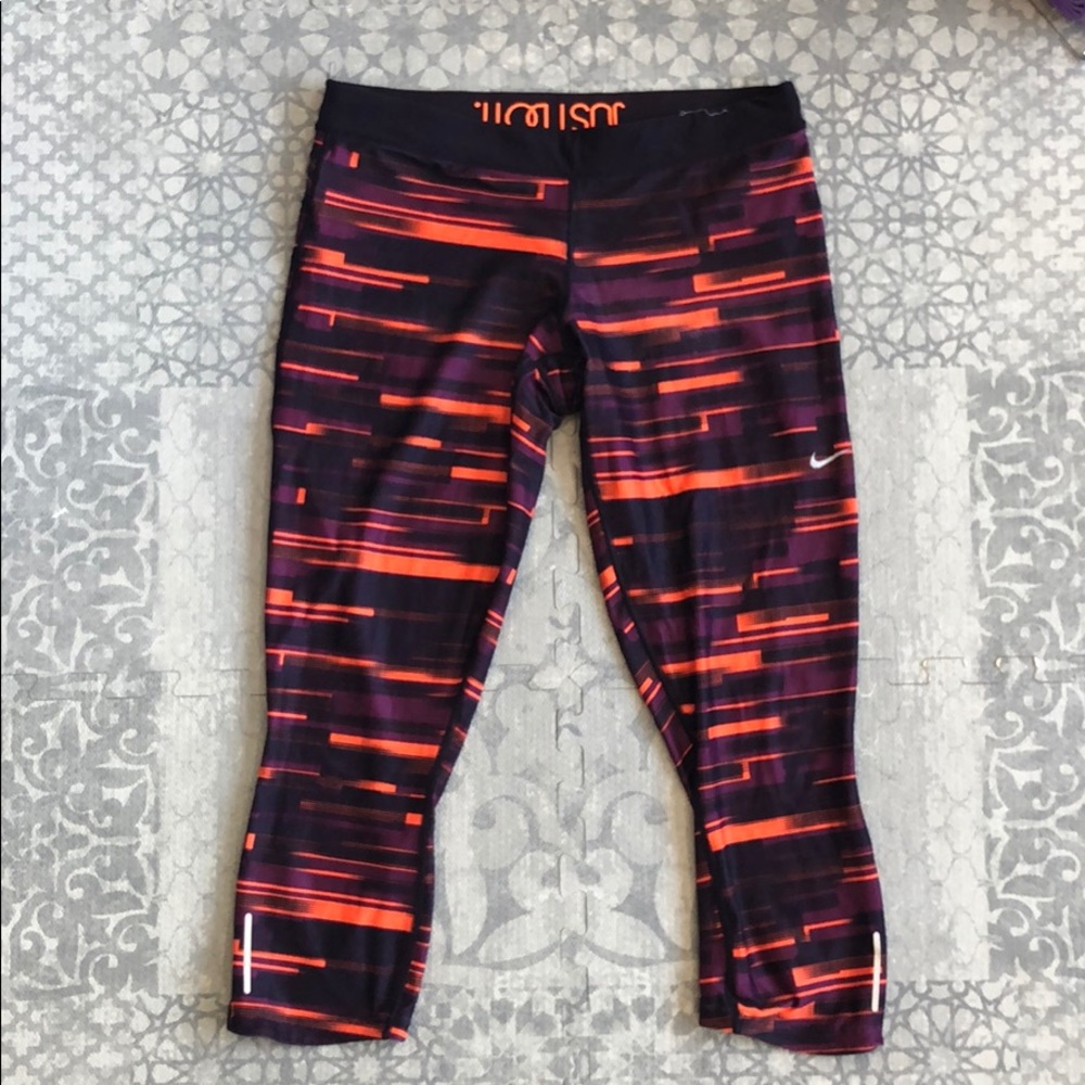 Purple & orange Nike women’s workout pants.